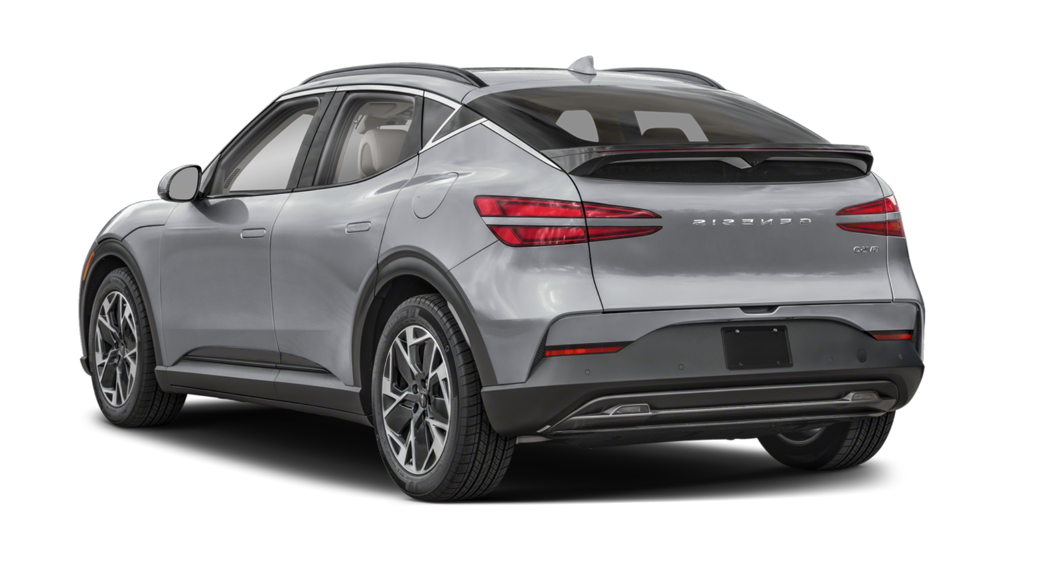 2025 Genesis GV60 rear exterior view in sleek silver with LED taillights, Genesis badge, and sporty hatchback design