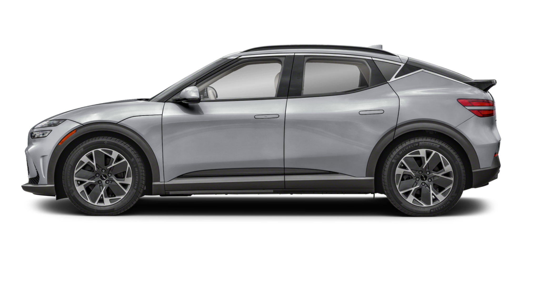 2025 Genesis GV60 side profile showcasing aerodynamic lines, silver body finish, and 19-inch alloy wheels