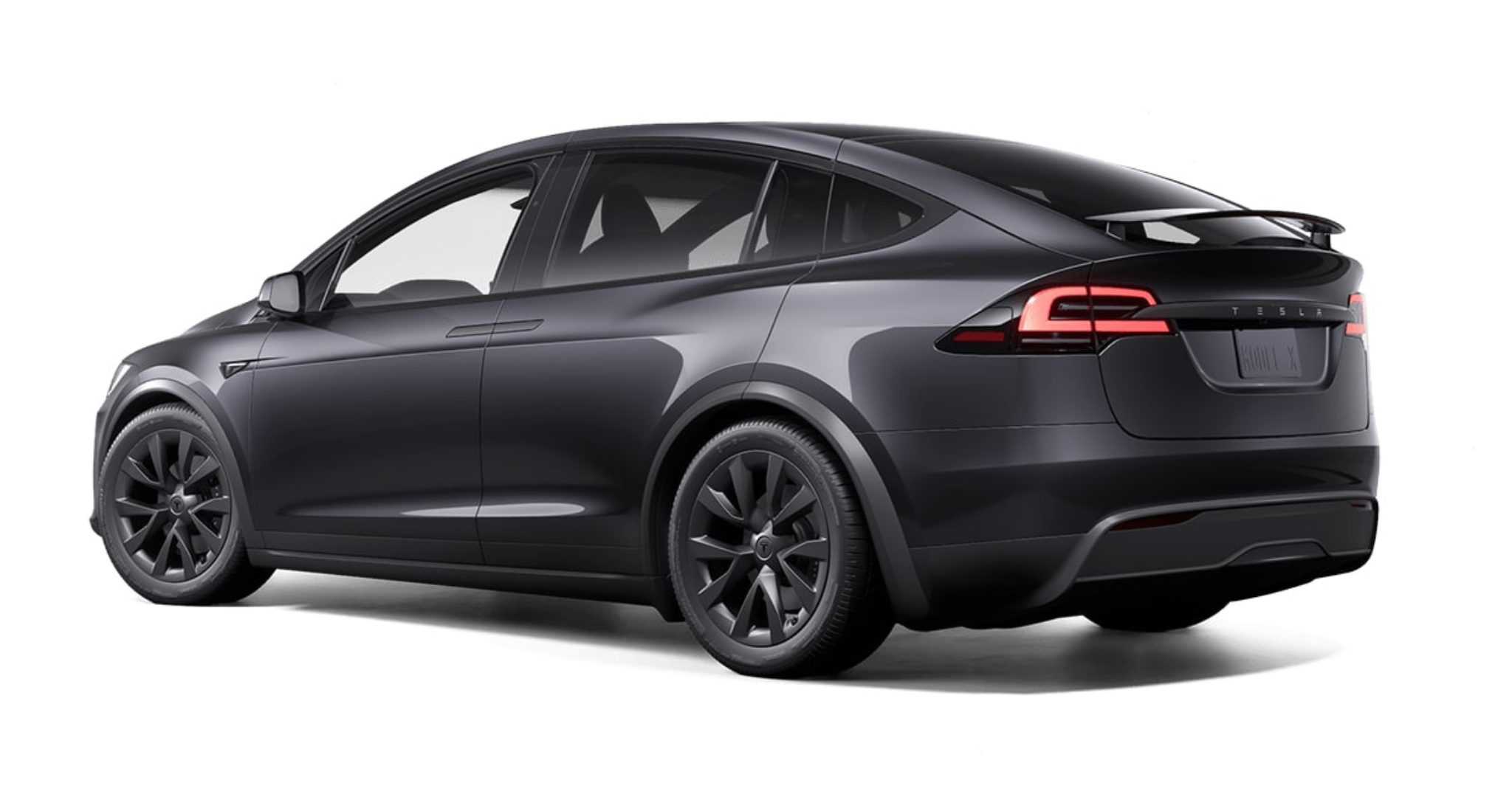 2025 Tesla Model X AWD rear angle showcasing LED tail lights, aerodynamic design, and Falcon Wing door profile