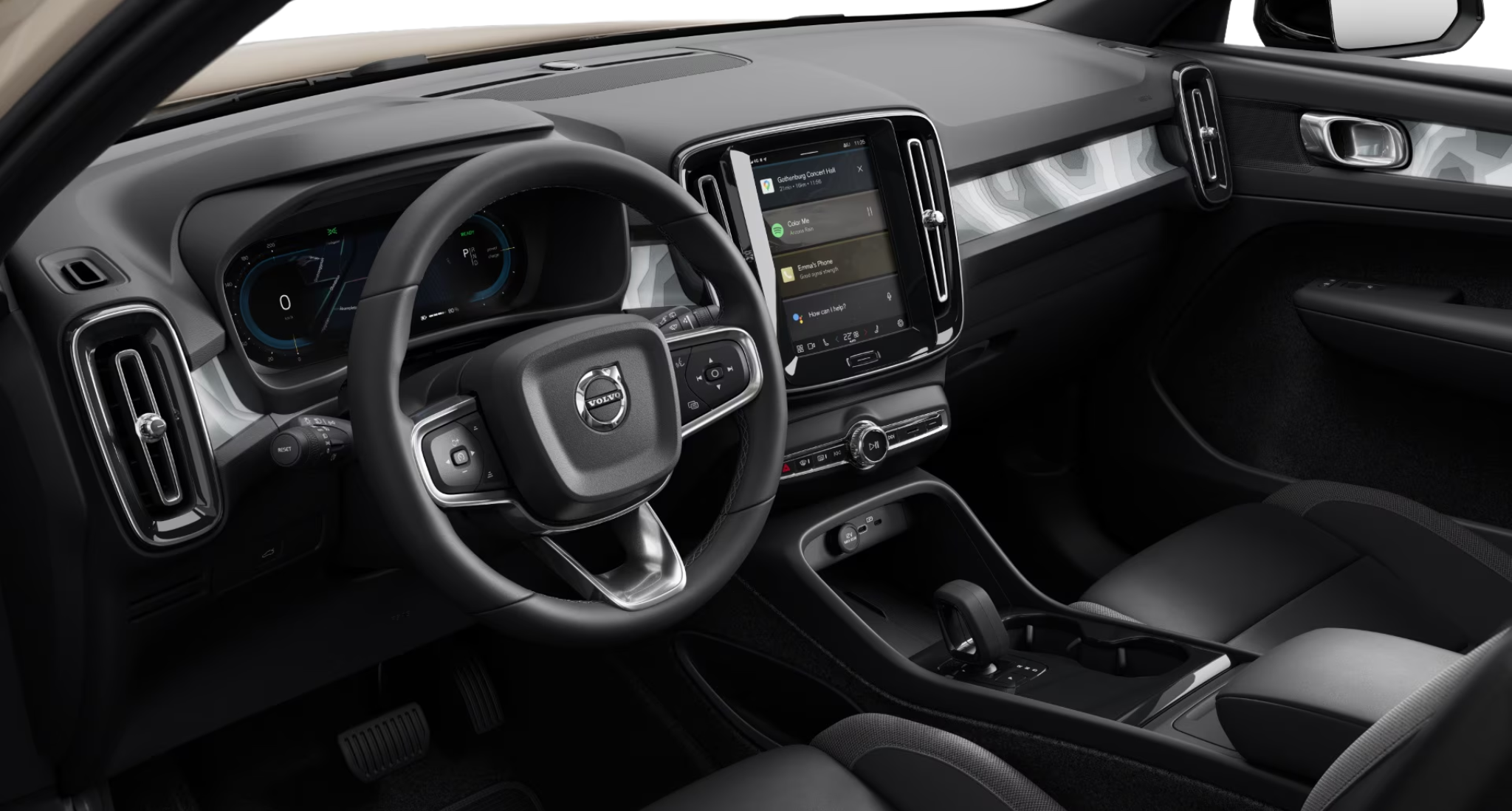 Interior view of the 2025 Volvo EX40 AWD Core featuring a digital driver display, Google-integrated touchscreen, and premium trim.