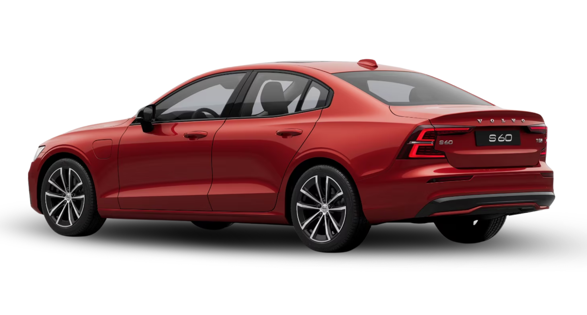 Rear three-quarter view of the 2025 Volvo S60 PHEV AWD in red with T8 badge and sculpted LED taillights