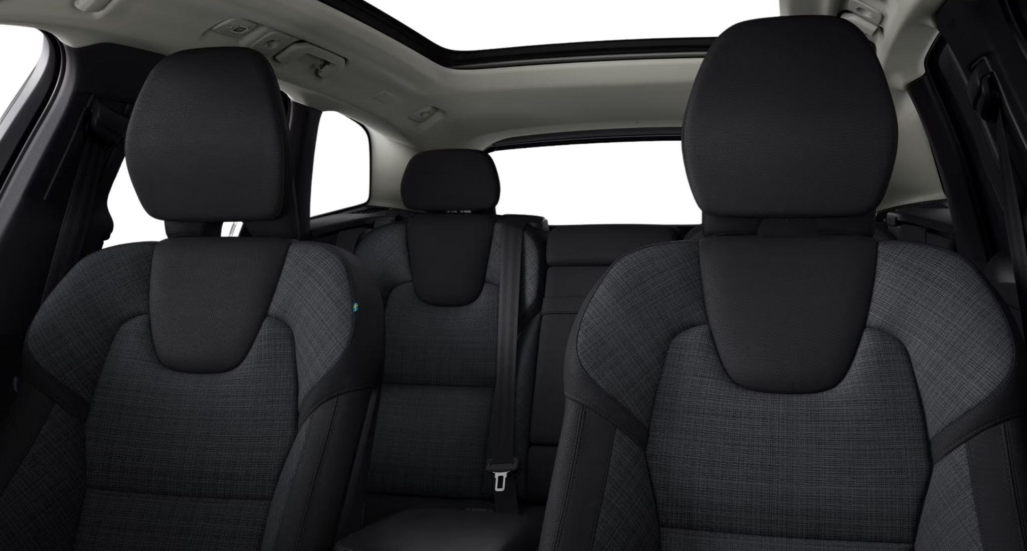 2025 Volvo XC60 PHEV AWD interior view featuring premium textile seats, panoramic roof, and rear passenger comfort.