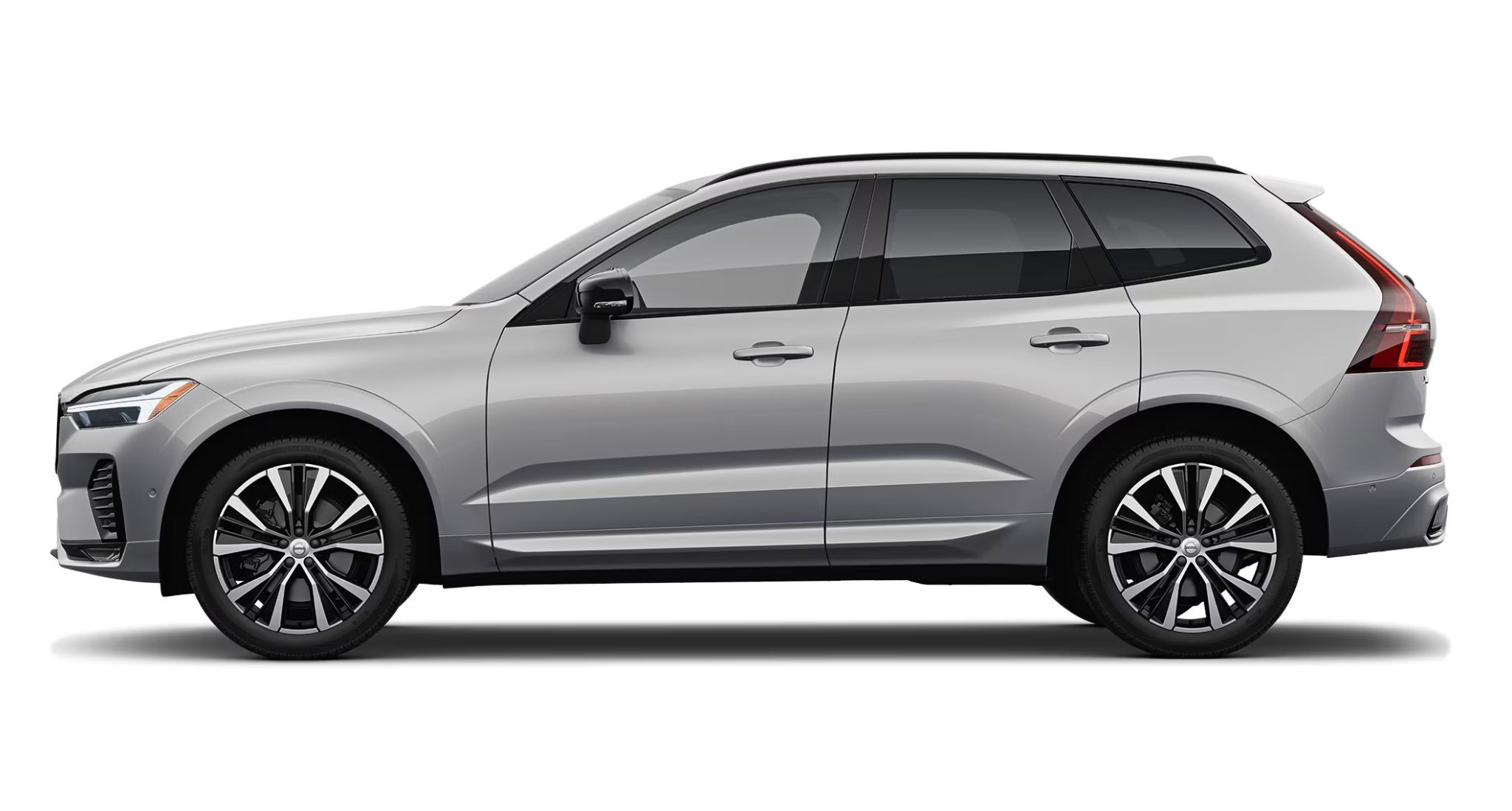Side view of the 2025 Volvo XC60 PHEV AWD showcasing aerodynamic lines, 18-inch alloy wheels, and silver exterior finish.