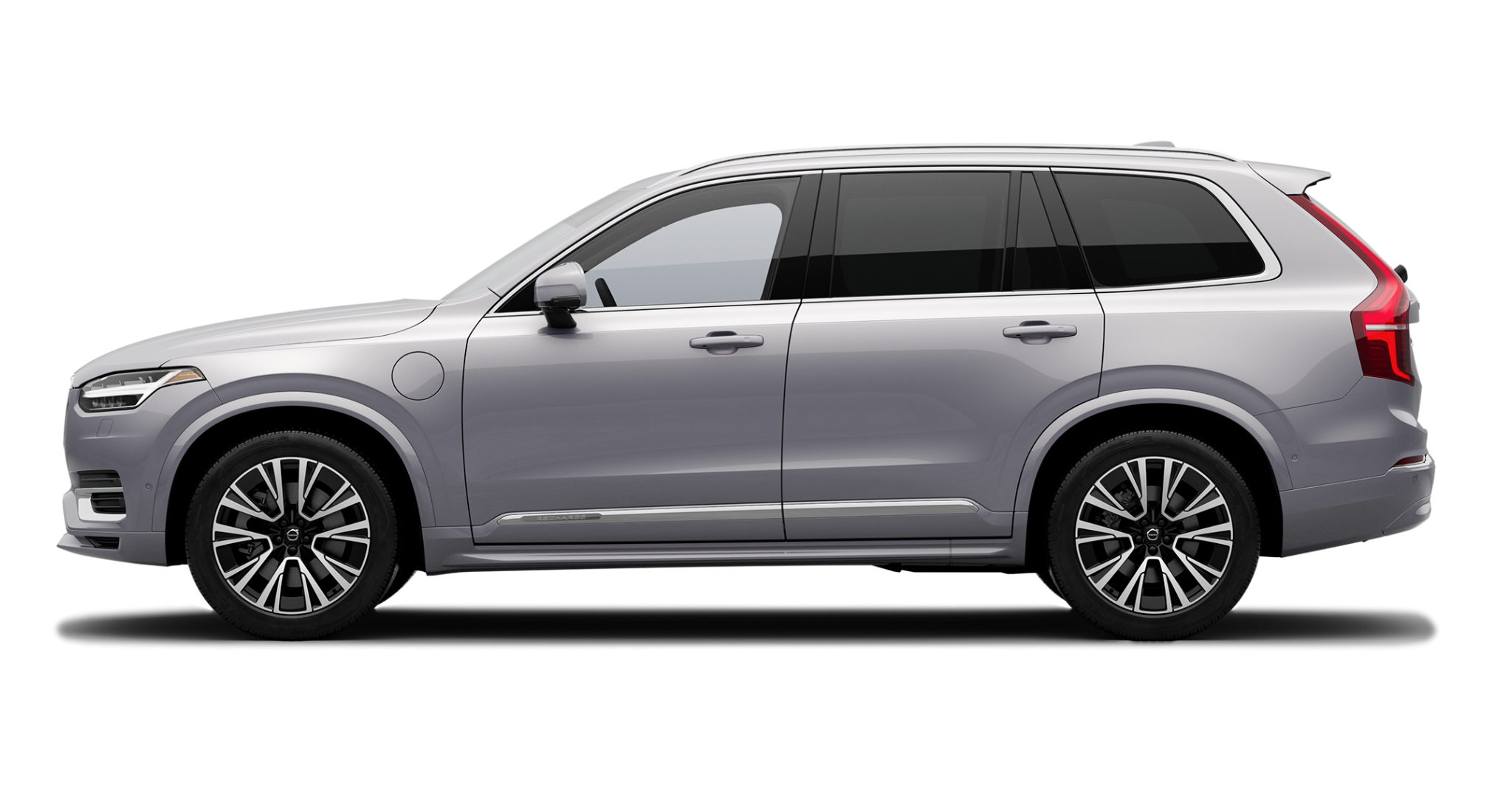 Side profile of the 2025 Volvo XC90 PHEV AWD in silver, showcasing plug-in hybrid badge and aerodynamic design.