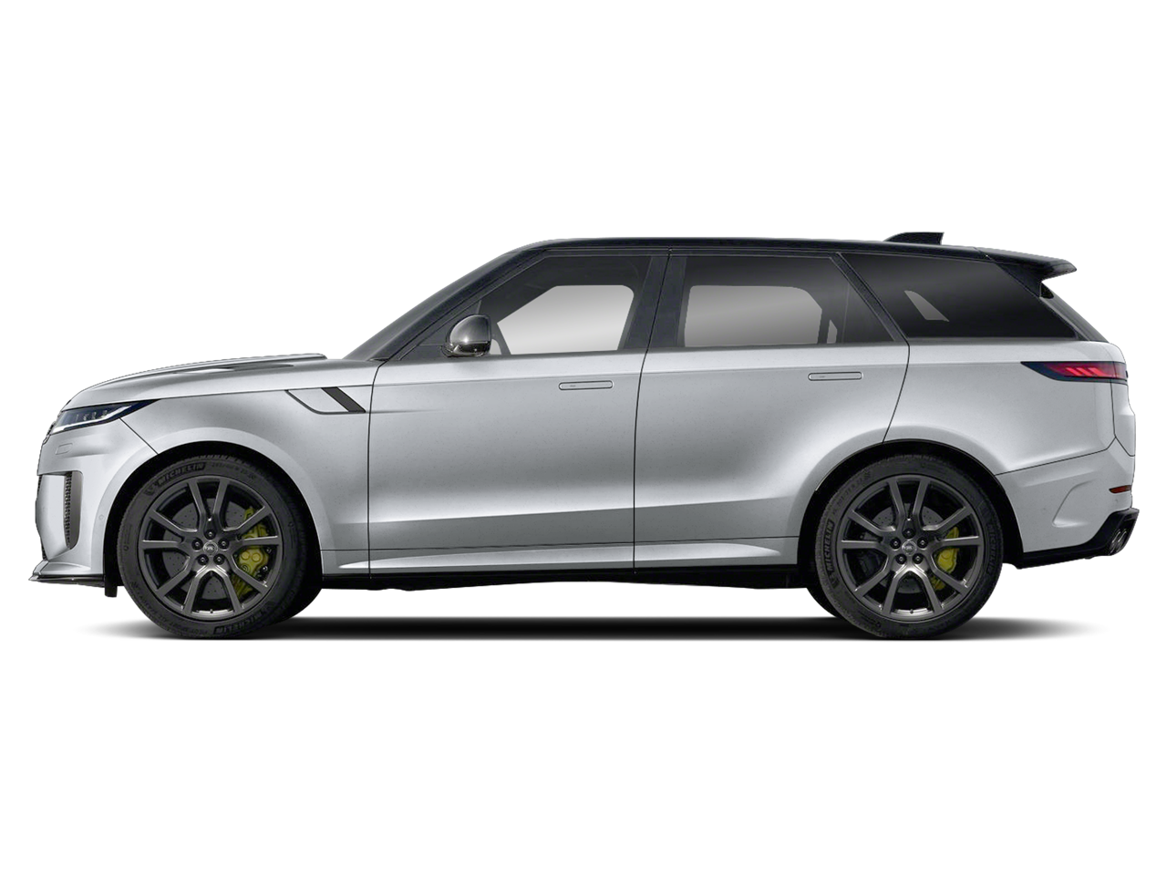 Side profile of the 2025 Land Rover Range Rover Sport SE AWD in white, showing 21-inch wheels, aerodynamic lines, and panoramic roof.