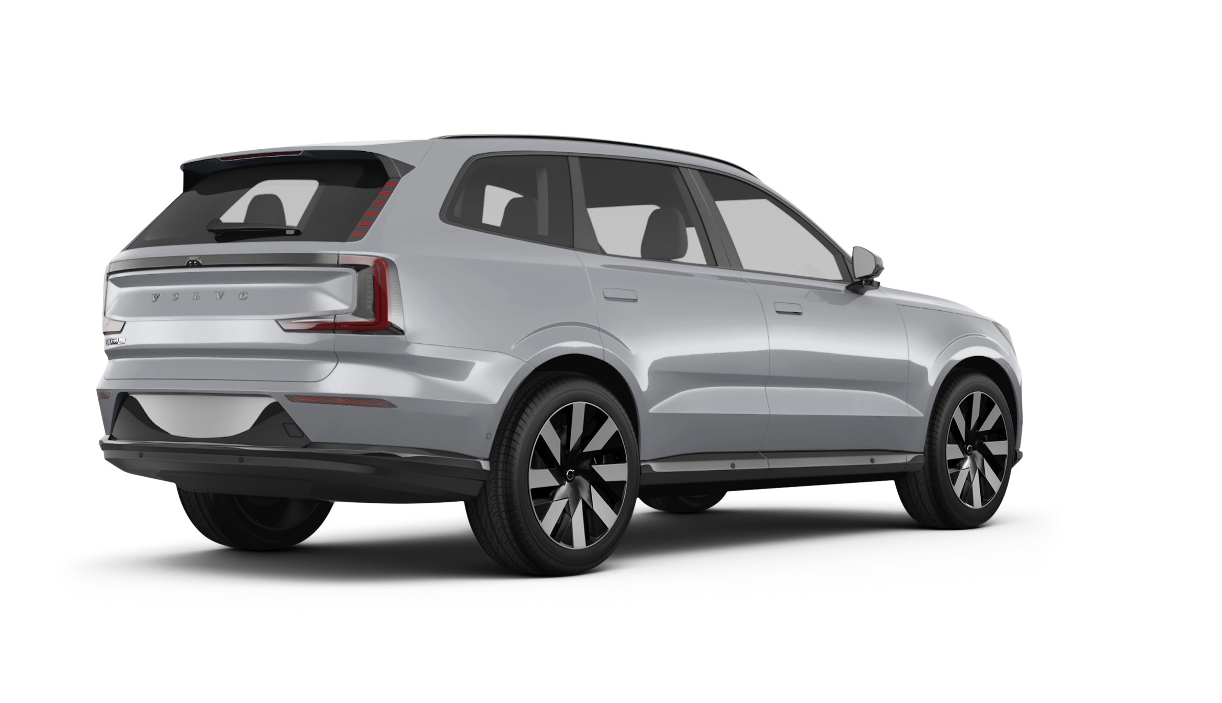 rear three-quarter view of 2025 Volvo EX90 Plus AWD in silver, showcasing LED tail lights and bold electric SUV design