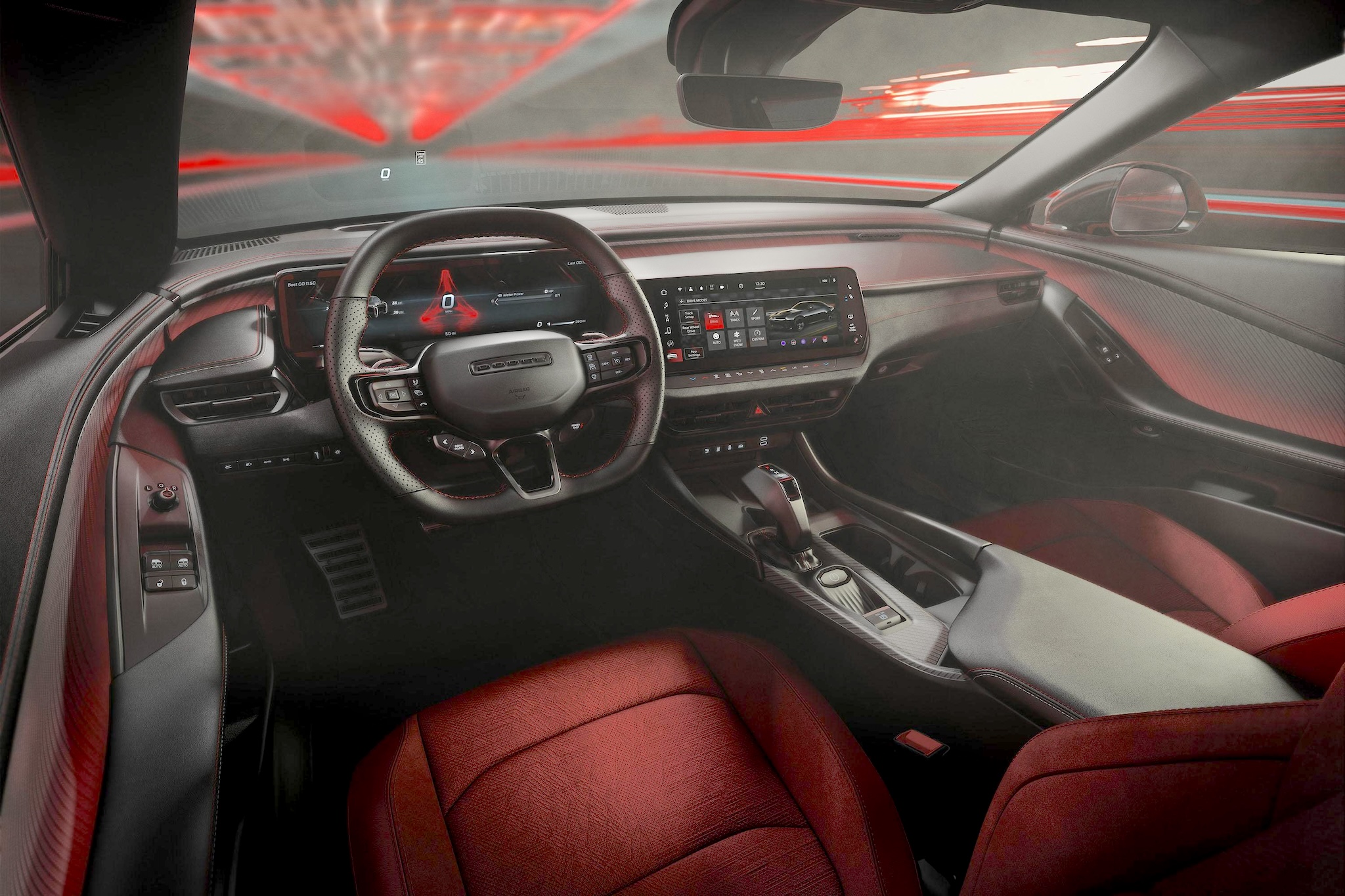 Interior view of the 2025 Dodge Charger R/T AWD showing the Uconnect 5 touchscreen, digital gauge cluster, and performance steering wheel.